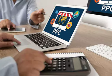 Google my business icon with PPC on a laptop and man hands working