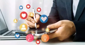 Business professional managing social media marketing on a tablet with engagement icons – promoting digital strategies for small yard landscapers to grow online.