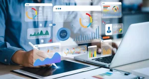 Digital marketing analytics dashboard with graphs and charts displayed on screen, person analyzing performance data on tablet and laptop – concept of effective digital marketing strategies for landscape businesses