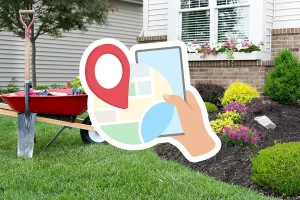 Google Business Profile concept for landscapers showing a smartphone map icon in front of a landscaped yard with flowers, mulch, and garden tools.